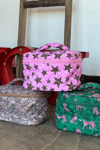 Quilted Puffer Makeup Bags - 3 Colors! are makeup and/or cosmetic bags that are made of a printed, quilted material