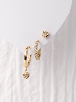 Anika Earrings - Set of 3 is a set of gold hoop earrings with heart charm