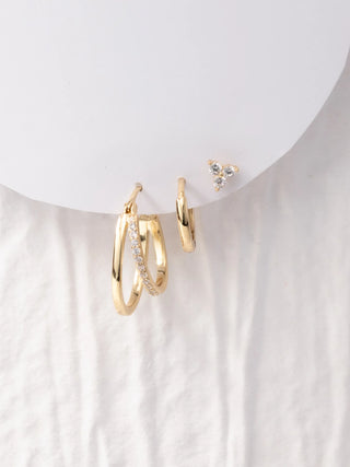 Erwin Earrings - Set of 3 is a set of 3 gold hoop earrings with small diamonds o