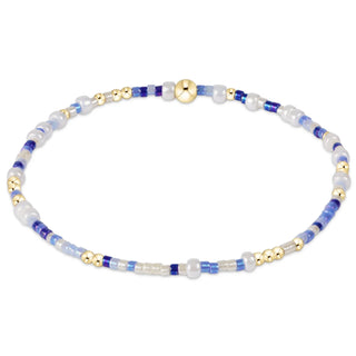 enewton Hope Unwritten Bracelet - Is A Smurf's Butt Blue? is a beaded bracelet with blue, white, and gold beads 