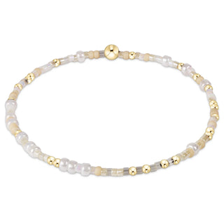 enewton Hope Unwritten Bracelet - Oh Snow You Didn't! is a bracelet with gold and white beads 