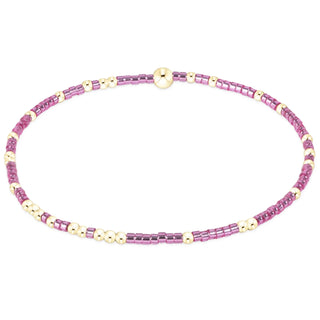 enewton Hope Unwritten Bracelet - Pink Metallic  is a bracelet with metallic pink and gold beads 