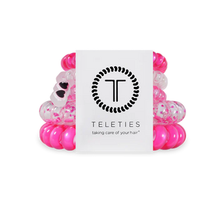 Teleties Flirt Alert Mix Pack Hair Ties are a pack of pink and clear hair ties with a Teleties branded card on a white background