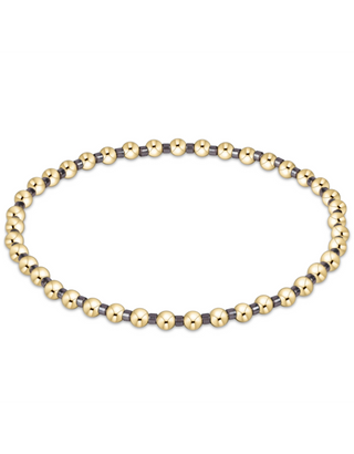 enewton Hope Grateful Bracelet - Taupe With A Twist is a bracelet with gold and taupe-colored beads. 