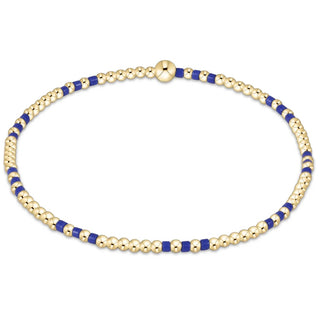 enewton Hope Joy Pattern 2mm Bead Bracelet - Blue Metallic is a gold and metallic blue beaded bracelet. 