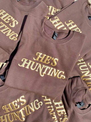 Dark chocolate sweatshirt with gold puff He’s Hunting wording 