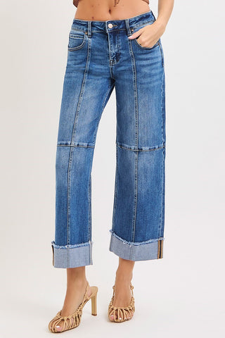 Risen Slouchy Crop Wide Leg Seam Detailed Jeans are denim blue jeans with seam detail on the front and a bottom cuff