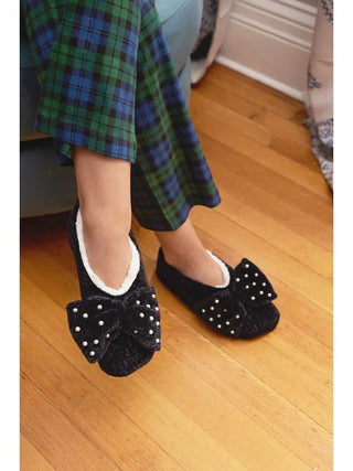 Precious Pearls Chenille Bow Accent Sherpa-Lined Slippers is a pair of black chenille slippers with pearl accents on the bow top. 