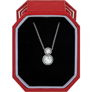 Brighton Infinity Sparkle Petite Necklace w/ Gift Box is a silver necklace with a circular pendant in a red and black jewelry box