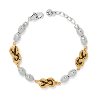 Brighton Interlok Single Knot Drops Bracelet is a bracelet with gold knots and silver bead designs 